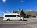 A camper van in front of the Prince of Wales Hotel at Waterton Lake National Park in Waterton Park, AB Canada