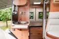 Camper van inside modern interior in luxury motorhome on rv vanlife concept Royalty Free Stock Photo