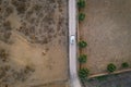 Camper van with solar panels drone aerial top view with cows on a rural landscape agriculture field