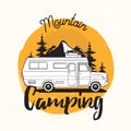 Camper van, travel trailer or recreational vehicle driving on road against mounts and forest on background and mountain