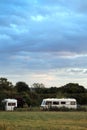 Camper vans under a grey sky in Cheddar