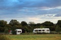 Camper vans under a grey sky in Cheddar
