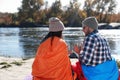 Campers sitting in sleeping bags