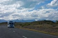 A campervan driving on the road in New Zealand Royalty Free Stock Photo