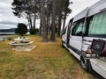 Campervan at Matarangi harbour side. Coromandel. New Zealand. Summer camping trip Royalty Free Stock Photo