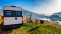 Campervan, Motorhome RV parked next to the lake or river in Bosnia and Herzegovina. Family with camper van or motor home eating Royalty Free Stock Photo