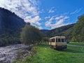 Campervan parked near river on regional park in New Zealand