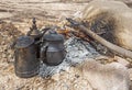 Campfire with cooking pots in hot desert climate Royalty Free Stock Photo