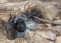 Campfire with cooking pots in hot desert climate Royalty Free Stock Photo