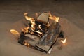 A campfire in the desert sand Royalty Free Stock Photo