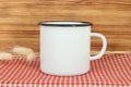Campfire enamel white metal mug with black line on the edge. Old tin cup design template Royalty Free Stock Photo