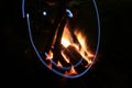 Campfire in fire pit at campsite. Royalty Free Stock Photo