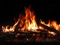 Campfire flames warm up cool nights Royalty Free Stock Photo