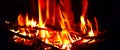Campfire flames a favorite summertime campground event as panoramic banner Royalty Free Stock Photo