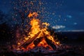 Campfire at night. Flames of fire against cloudy sky. Bonfire in the country. AI Generated Royalty Free Stock Photo