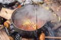 Campfire soup in iron kettle Royalty Free Stock Photo