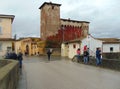 Campi Bisenzio, Italy, Historical center of the town, view of the old castle and bridge with people