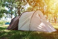 Campimg tent in pine forest in a summer day. Tourist camp Royalty Free Stock Photo