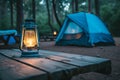 Camping acetylene lantern on wooden table with blurred background in camping area at natural parkland