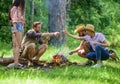 Camping activity. Company friends prepare roasted marshmallows snack nature background. Company youth camping forest Royalty Free Stock Photo