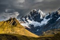 Camping beneath Cordillera Huayhuash mountains with dramatic rain clouds, Peru, South America