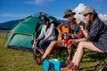 Camping camp in nature happy friends group playing music guitar Royalty Free Stock Photo