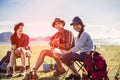 Camping camp in nature happy friends party and playing guitar together in summer Royalty Free Stock Photo