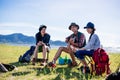 Camping camp in nature happy friends party and playing guitar together in summer Royalty Free Stock Photo