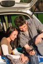 Camping car happy couple look camera sunset Royalty Free Stock Photo