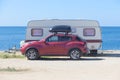 Camping car and trailer by the sea Royalty Free Stock Photo