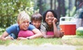 Camping, children and relaxing in portrait on vacation, bonding and happy for outdoor adventure. Kids, face and smiling Royalty Free Stock Photo