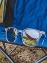camping concept reflection of hammock in sunglasses Royalty Free Stock Photo
