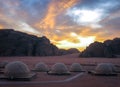 Camping domes at sunset in the desert in Wadi Rum, Jordan.