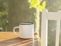 Camping enamel coffee cup in an outdoors garden