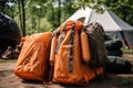 Camping equipment in the forest. Backpack and tent on background. travel bags in front of a camping tent hiking gear, AI Generated