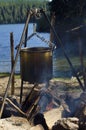 Camping fire on a lake shore Royalty Free Stock Photo
