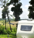 Camping in France with caravan between trees