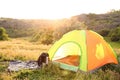 Camping gear and tourist tent in wilderness