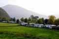 The camping on the green field in the mountains.