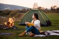 Camping on green meadow on river and mountain background Royalty Free Stock Photo