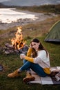 Camping on green meadow on river and mountain background Royalty Free Stock Photo