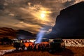 Camping group ans cars in Sahara Desert by night. Royalty Free Stock Photo