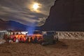 Camping group in Sahara Desert by night. Royalty Free Stock Photo