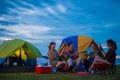 Camping of happy asian young travellers at lake Royalty Free Stock Photo