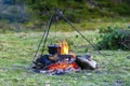 Camping kitchenware - pot on the fire at an outdoor campsite Royalty Free Stock Photo