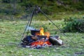 Camping kitchenware - pot on the fire at an outdoor campsite Royalty Free Stock Photo