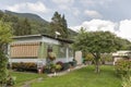 Camping life with trailers in Alpine nature park Royalty Free Stock Photo