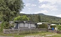 Camping life with trailers in Alpine nature park Royalty Free Stock Photo