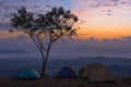 Tourist tent in camp among meadow in the mountain at sunrise Royalty Free Stock Photo