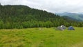 Camping is in mountains. Three tents on a background mountains. Royalty Free Stock Photo